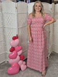 pink and white patterned short-sleeve maxi dress